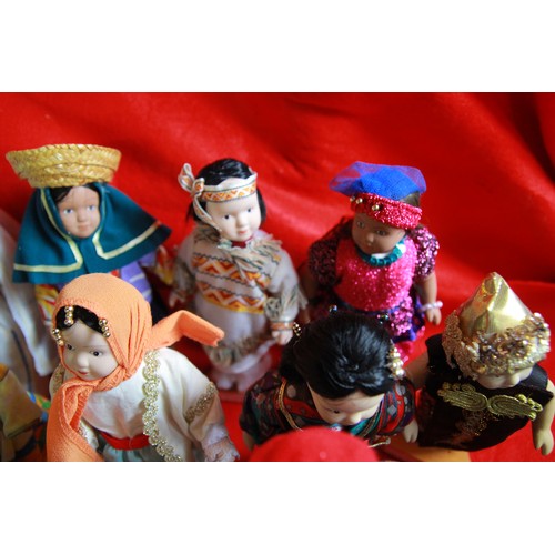 29 - A collection of 'Dolls of the World', plus stands