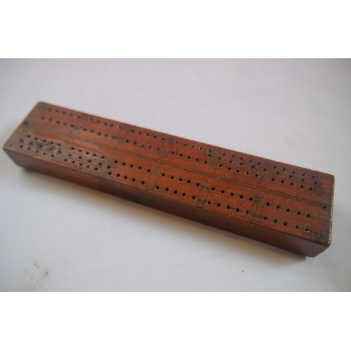 207 - An antique wood cribbage set with bone pieces