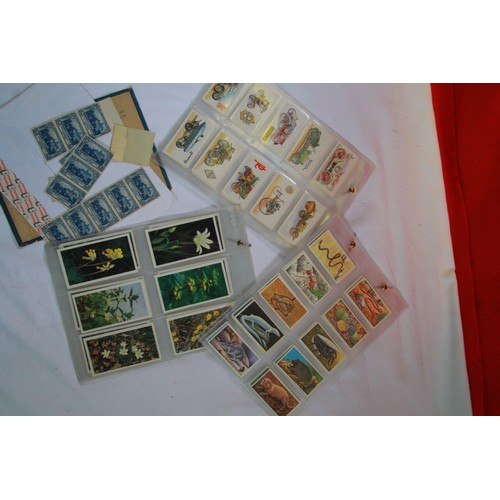 84 - A selection of ephemera including cigarette cards, stamps inc. Hyde Park, and a vintage board game