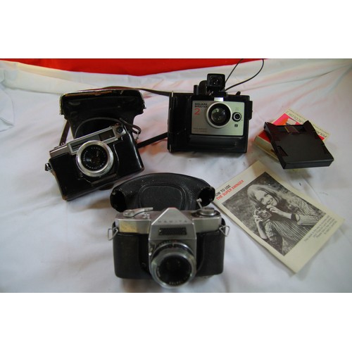 154 - A Mamiya 35mm camera with Mamiya-Sekor lens, a Yashica 35mm camera, and a Polaroid Camera with film,... 