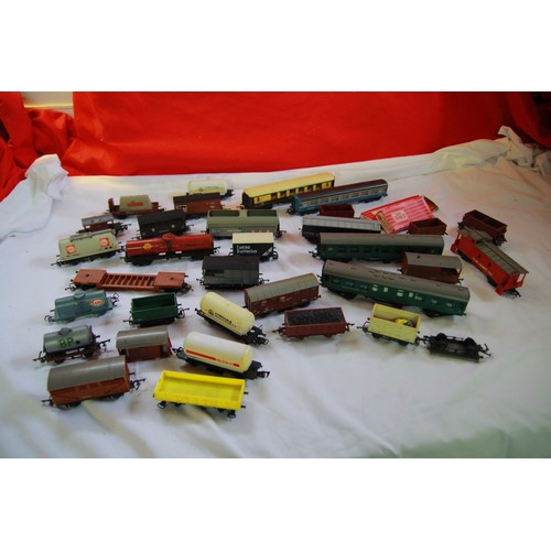 155 - A box of model railway items including carriages and trucks plus a box of track both vintage and new