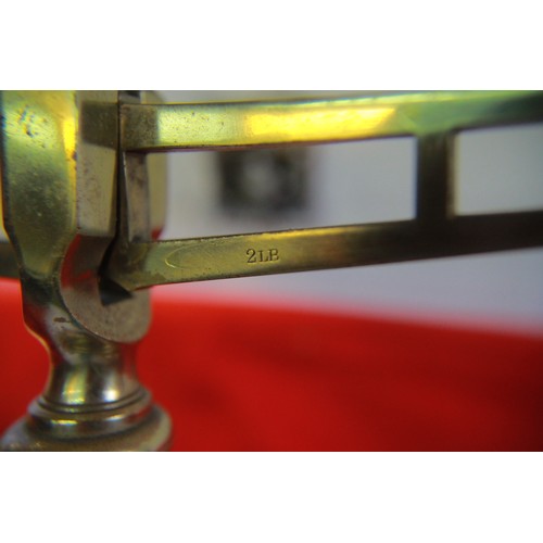 22 - A large set of vintage brass scales and weights, the whole mounted on a wooden plinth