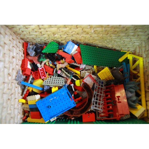 203 - A wicker basket containing lego, an Action Man and other toys