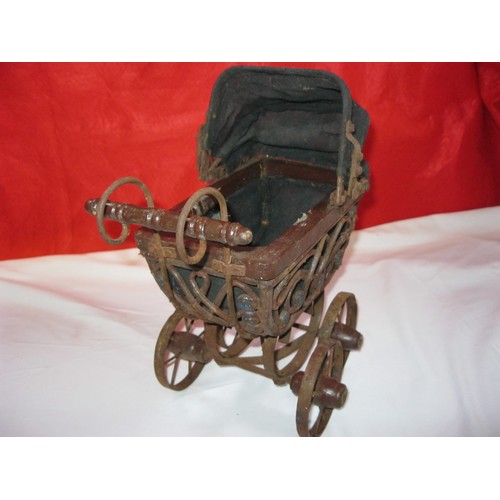 204 - An antique toy pram, believed to be French and Victorian