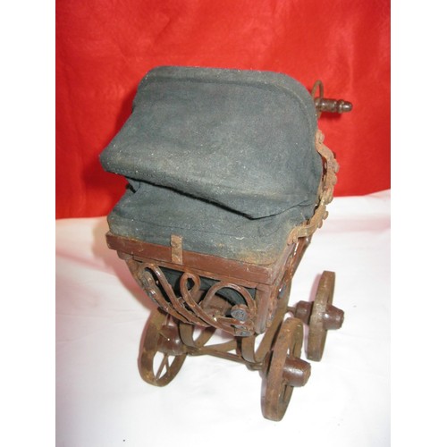 204 - An antique toy pram, believed to be French and Victorian