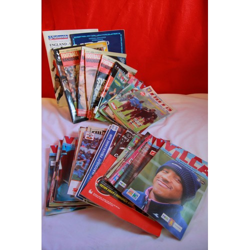 175 - A large selection of vintage football programmes and ticket stubs