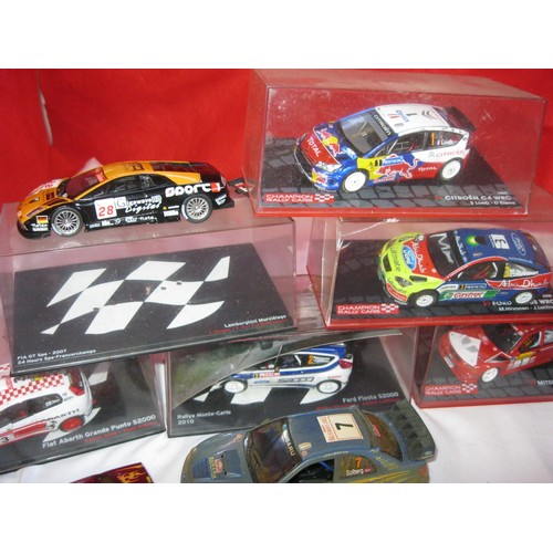 197 - An assortment of die-cast cars including WRC, some cased, a Batman car and a Hot Wheels car