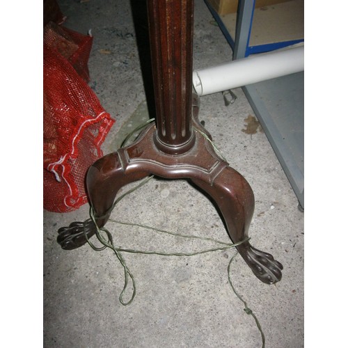 113 - An imposing darkwood standard lamp with fluted shaft standing on tripod base, roughly 5'6