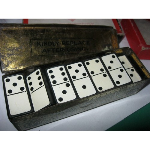 202 - A tray of games including multiple sets of vintage dominos, card games etc