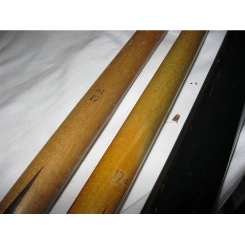 177 - A pair of snooker cues, both 17 1/2 oz, one in a metal tube case, and a box of snooker trophies all ... 