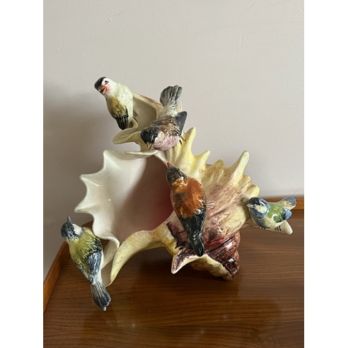 62 - Ceramic vase in the shape of a conch shell decorated with birds plus other decorative animals