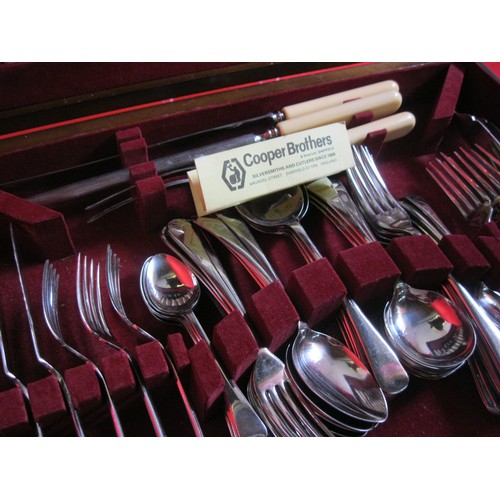 24 - A 6 place-setting wooden canteen of cutlery by Cooper Brothers, in good order