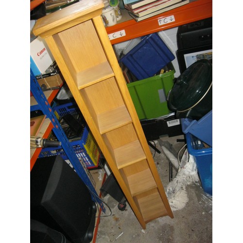 2 - A thin pine shelving unit