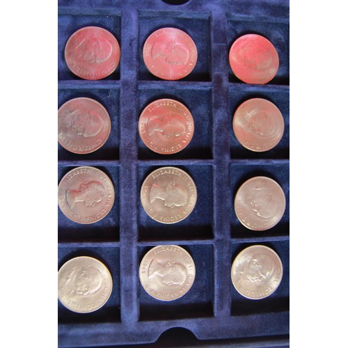 91 - A collection of 36 crowns housed in a blue velvet x36 coin Westminster presentatiotn box with two tr... 