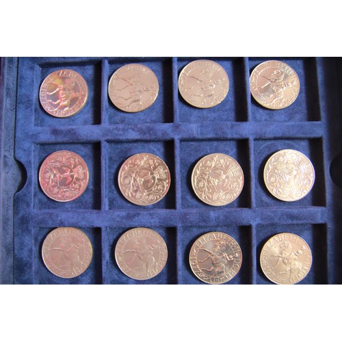 91 - A collection of 36 crowns housed in a blue velvet x36 coin Westminster presentatiotn box with two tr... 