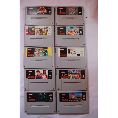 131 - A Nintendo Super Nintendo Entertainment System (SNES) with controllers, power unit, cables and 10 ga... 