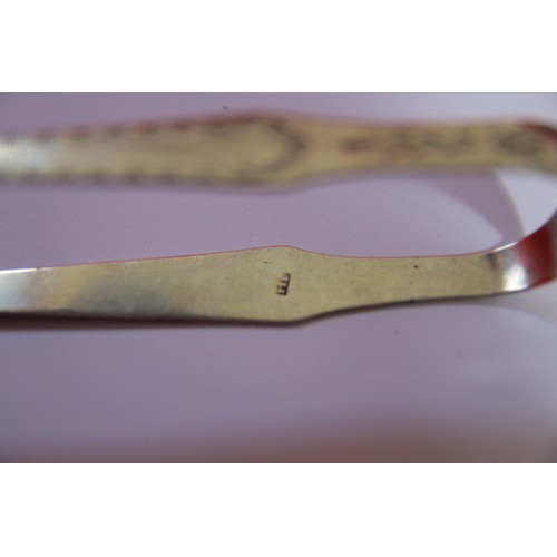 229 - A pair of George III Exeter bright-cut sugar tongs  by J Hicks