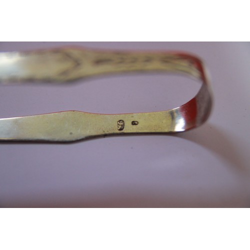 229 - A pair of George III Exeter bright-cut sugar tongs  by J Hicks