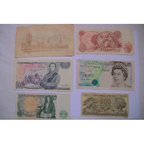 108 - An assortment of banknotes comprising a 1917 Bradbury 3rd Issue £1 Note (fair to good), A Gill Welli... 