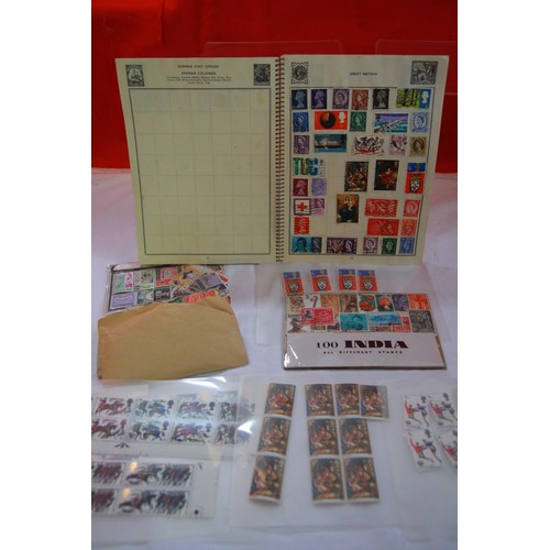 143 - A vintage stamp album and an assortment of loose stamps