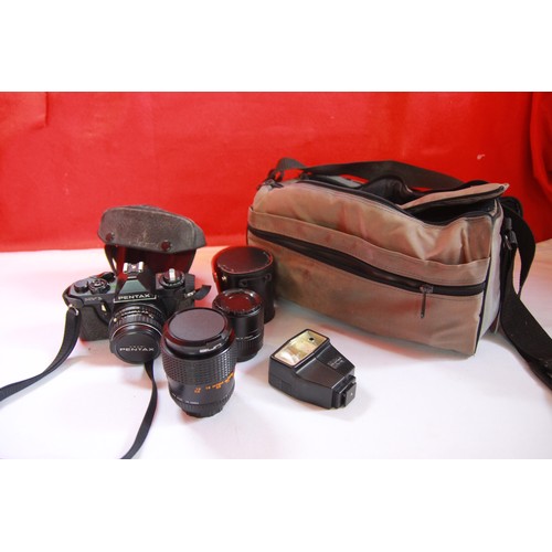 214 - An assortment of camera equipment including Nikon bags, flashes, tripods, cameras etc