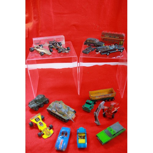 257 - A box of playworn Matchbox and Corgi die cast cars, trucks and other items