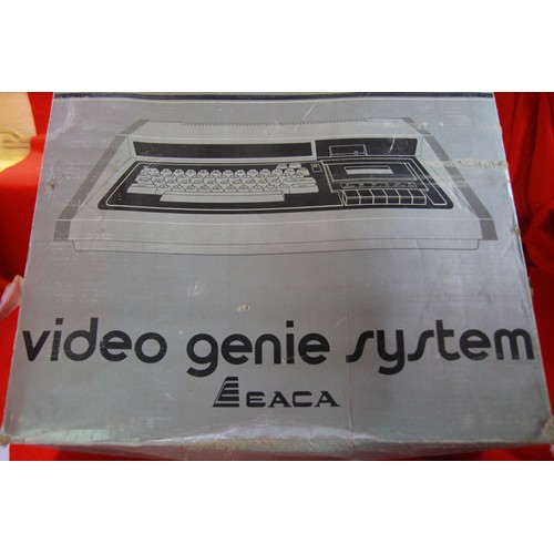 118 - A vintage EACA Video Genie Computer System in original box with instructions, program tapes etc