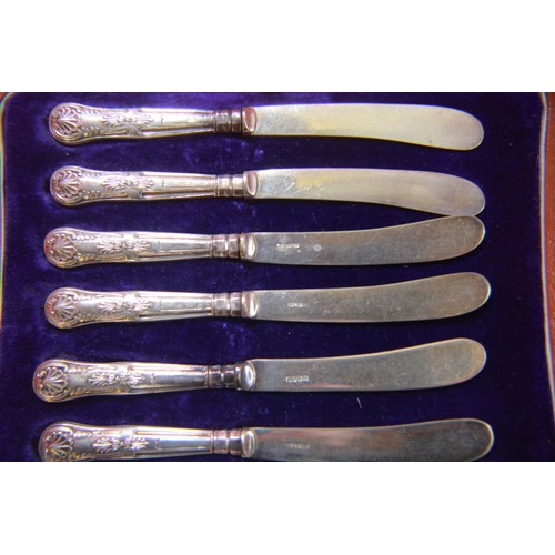 221 - Assorted cutlery and other items including a cased silver handled knife set, silver plate napkin rin... 