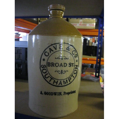 239 - A large earthenware flagon marked for Cave & Co, 32 Broad Street, Southampton, in good order