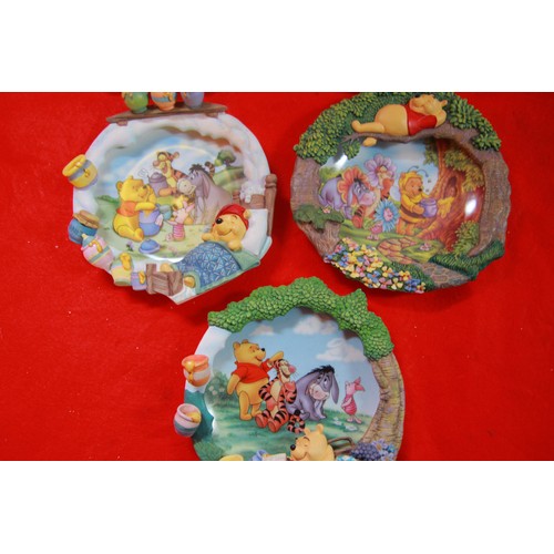 79 - 9 wall hanging plates with raised Disney figures inluding Winnie the Pooh