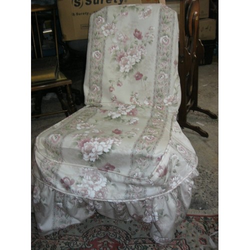 149 - A Victorian nursing chair with fabric cover, turned legs to front with original brass castors