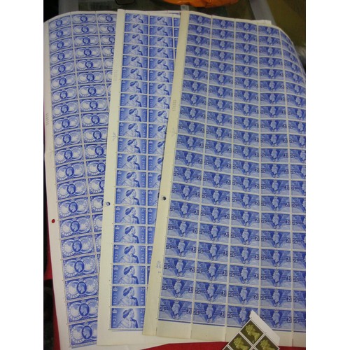 144 - A folder of mint UK stamps including several complete and partially complete sheets of unused stamps