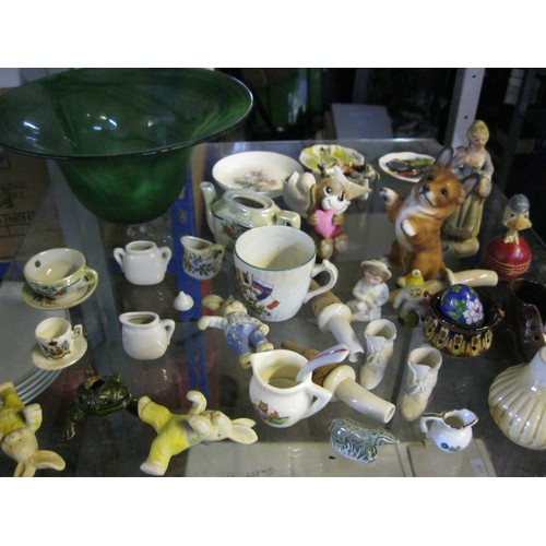 38 - A bowl of small figurines an other items including crested ware, a set of porcelain drawer handles, ... 