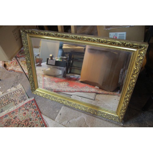 24 - Ornate, framed bevelled mirror