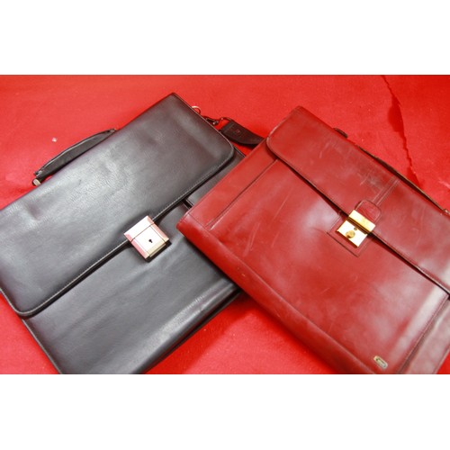 39 - A pair of briefcases, one in black leather with mobile and laptop pockets and carrying strap, the ot... 