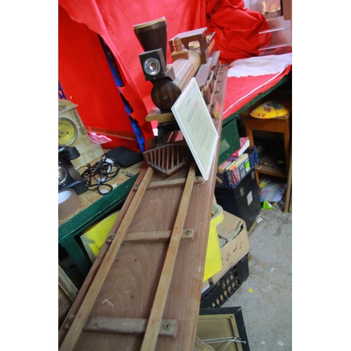 196 - A very large wooden model of the Kentucky Flyer sat on a 7' long display rail, hand made by the vend... 