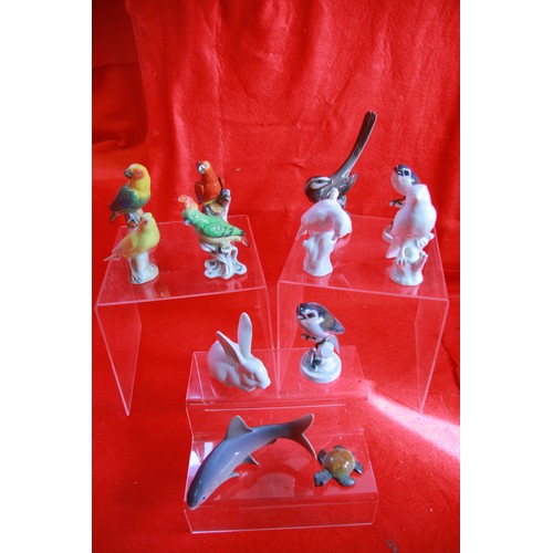 30 - An assortment of china figures, primarily birds