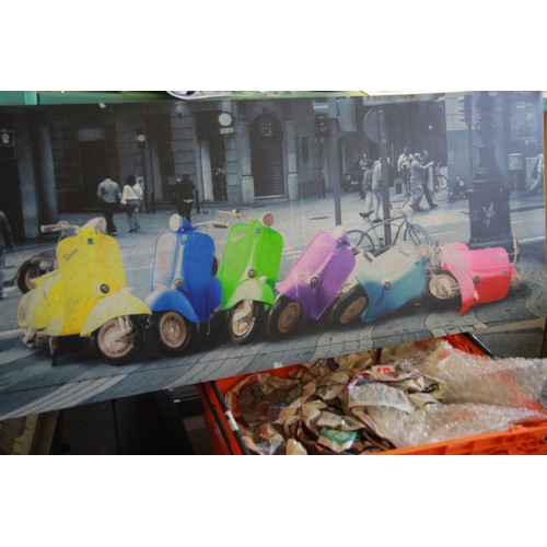 9 - A large colour print of Vespa scooters