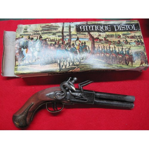 146 - Boxed Spanish-made replica James Barbar double-barrelled flintlock pistol. Slight damp damage to box... 