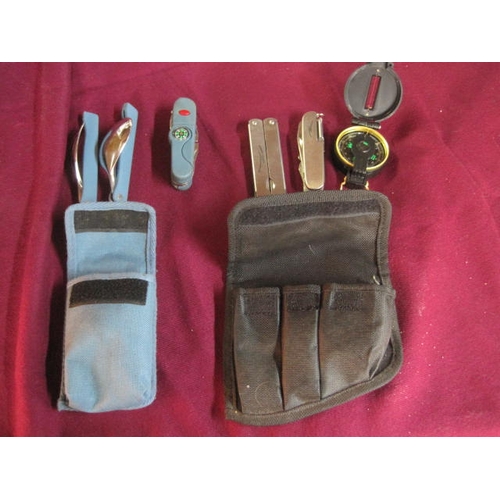 58 - An orienteering set comprising multitool, knife and compass in a belt pouch and a set of folding cut... 