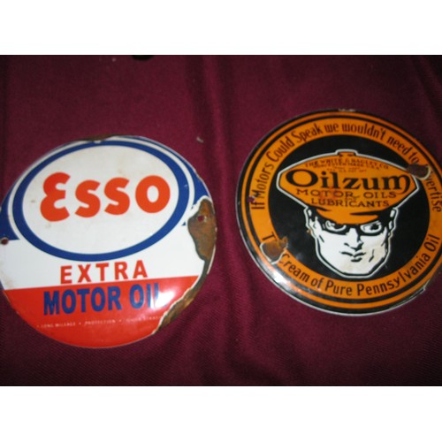 7 - A pair of small round retro-style enamel signs, one for Oilzum Motor Oil and one for Esso Motor Oil