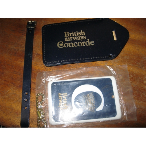 85 - A pair of British Airways Concorde luggage tags, both unused, one of heavy duty plastic still sealed... 