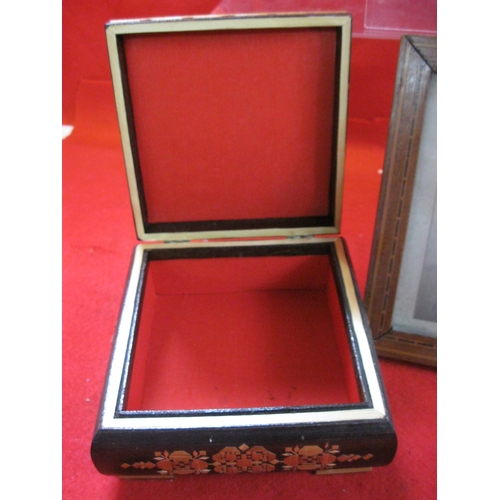 97 - A vintage art deco inlaid photo frame (slight a/f), an inlaid jewellery box and a turned wooden barr... 