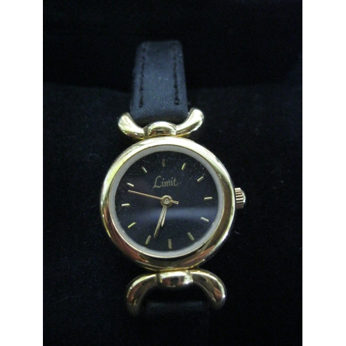 101 - A pair of ladies watches, the gold coloured one on a torque-style strap, both require batteries