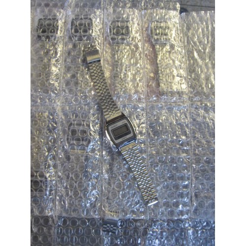 103 - 8 new old stock 'Saxon' digital LCD watches, in bulk packaging