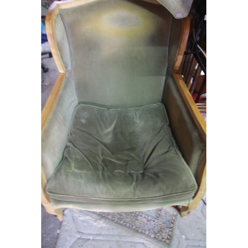 94 - A pair of green upholstered, elm framed deep wingback armchairs by OKA, with fire tags, one in good ... 