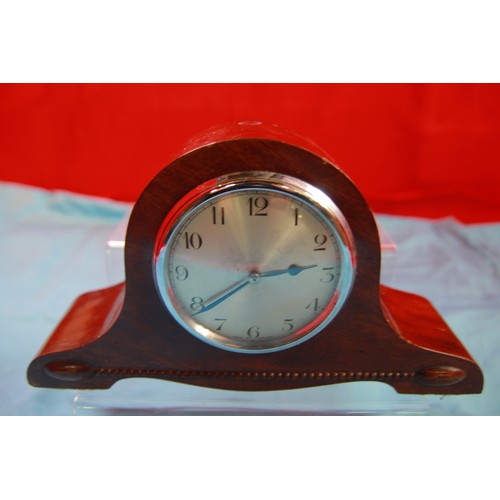 305 - Napoleon Top hat clock in working condition approx 6 inches tall by 10 wide