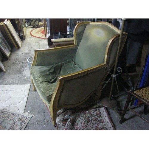 94 - A pair of green upholstered, elm framed deep wingback armchairs by OKA, with fire tags, one in good ... 