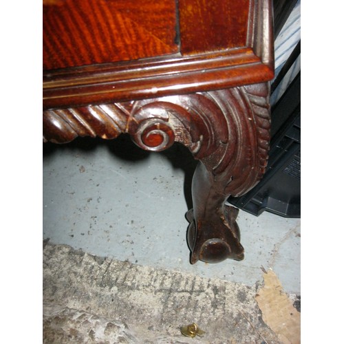 89 - An antique music cabinet with scrolled decoration and cabriole legs resting on claw and ball feet, w... 