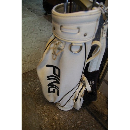 119 - A set of left handed golf clubs, many by Ping, in a Ping branded golf bag